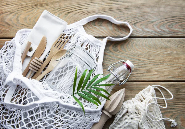 Cotton bags, net bag with reusable  glass jars, bamboo and wooden cutlery. Zero waste concept. Eco friendly. Flat lay