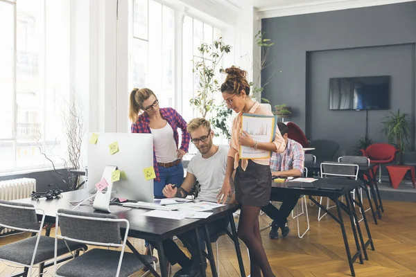 Young business people working at office on new project — Stock Photo, Image