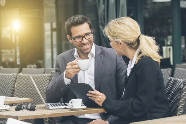 Businesspeople meeting during a coffee break