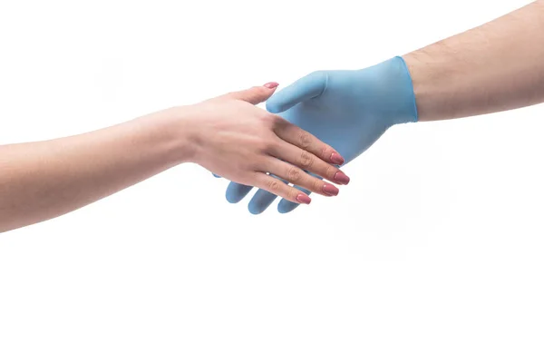 Hand in gloves shaking hand without gloves close up — Stock Photo, Image