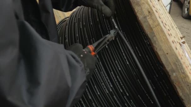 Sharp plier cuts an optical fiber cable. — Stock Video
