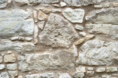 Tex arka plan bej taş duvarlar, parke taşı ile döşeme taş