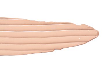 Sıvı bazlı boya darbeleri beyaza izole edilmiş. Kozmetik makyaj vakfı beyaz arka planda izole edilmiş, ton kremi lekeli, kapatıcı. Smar vuruşu.