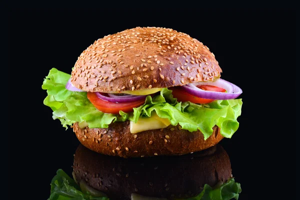 Fresh tasty burger on black background. Tasty and appetizing cheeseburger. Vegetarian burger — Stock Photo, Image