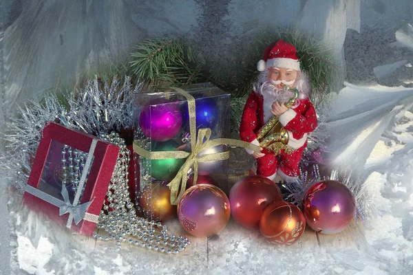 Christmas pictures with Santa Claus and Christmas balls and gifts . — Stock fotografie