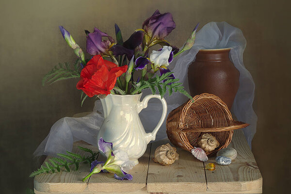 Still life with red poppy and irises , the ceramic vase and the basket of shells.