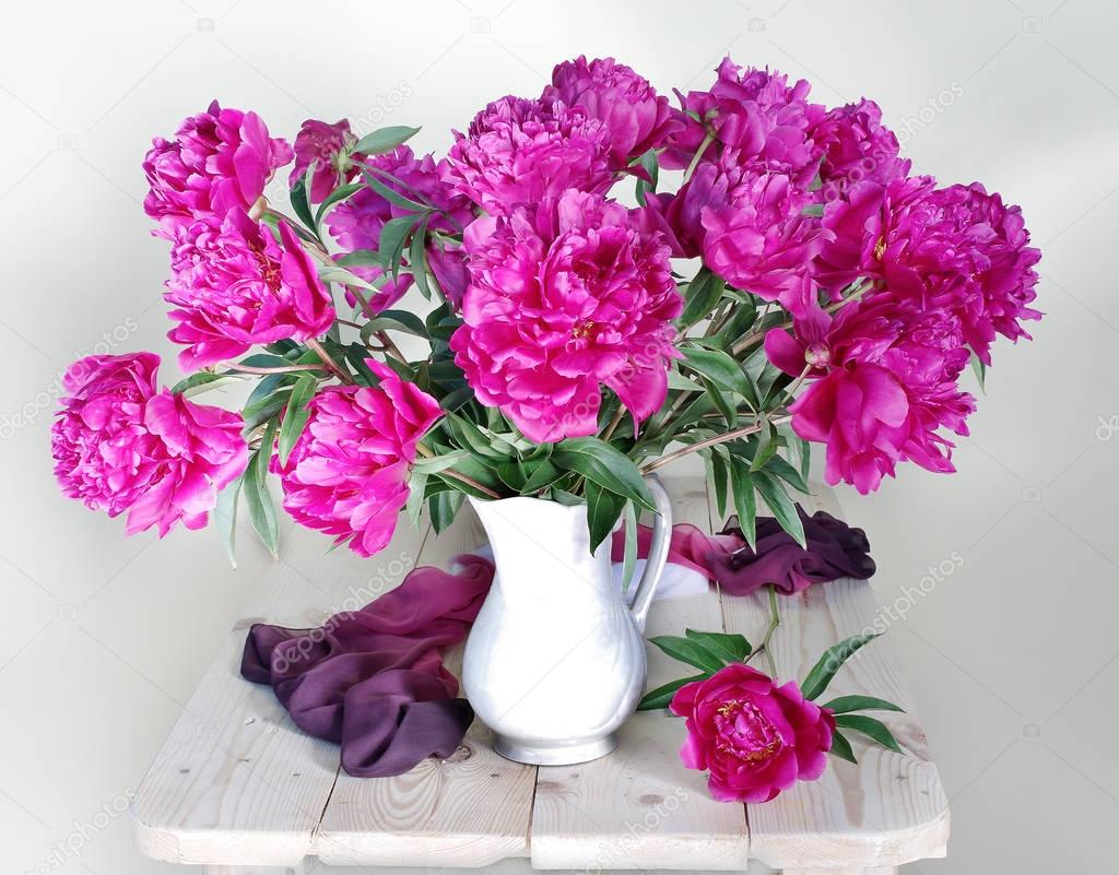 Pink peonies in vase isolated