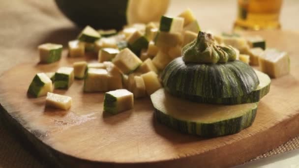 Sliced zucchini on a wooden cutting board — Stock Video