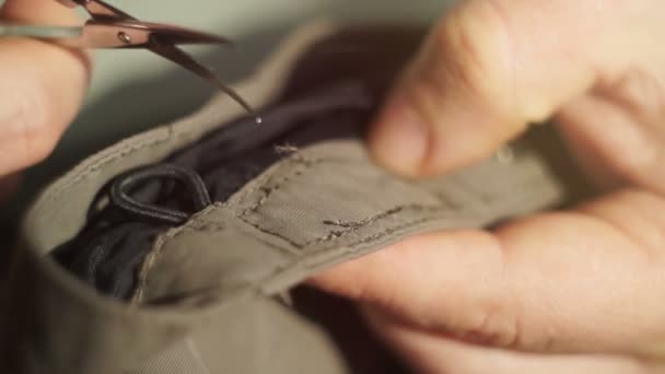 Close-up Tailor repairing clothes — Stock Video