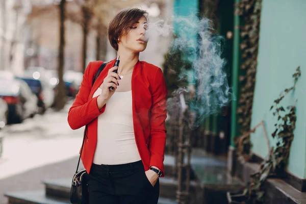 Girl with the electronic cigarette — Stock Photo, Image