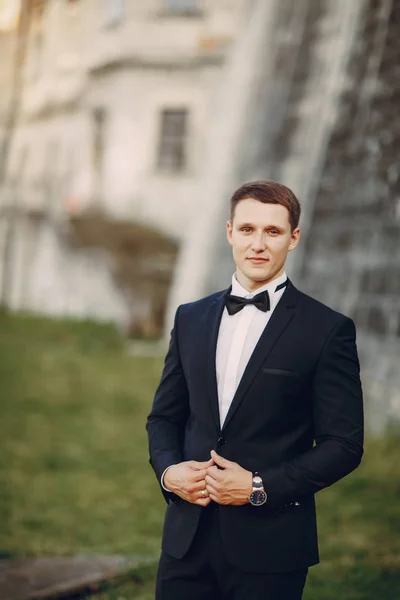 Groom in a black suit — Stock Photo, Image