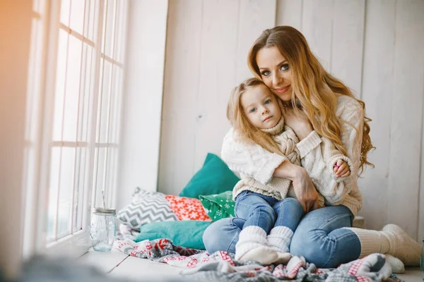 Mother and daughter by the window — Stock Photo, Image