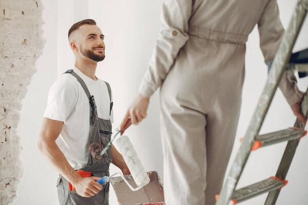 The young and cute family repairs the room