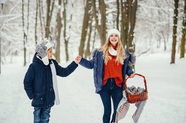 Mother with cute son in a winter oark — Stock Photo, Image