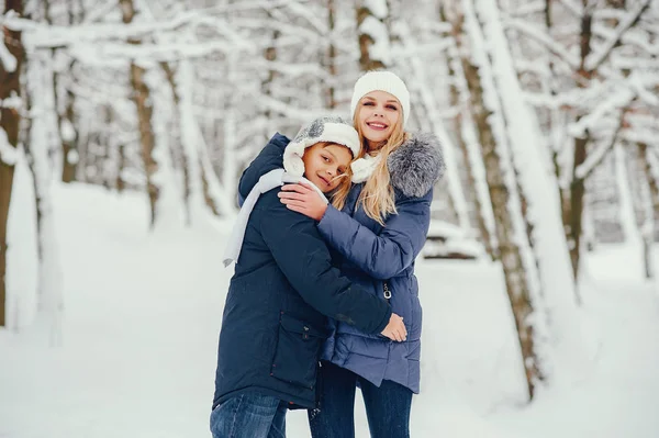 Mother with cute son in a winter oark — Stock Photo, Image