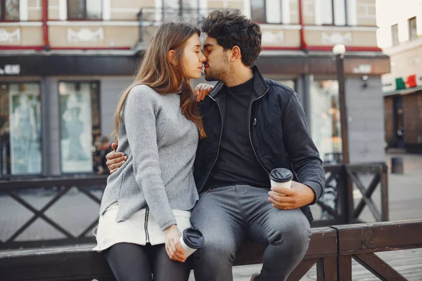 Beautiful couple spend time in a summer city