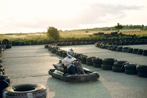 Handsome man in a karting with a car — Stok fotoğraf