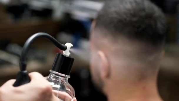 Closeup of barbers hands holding gel in barber shop — Stock Video