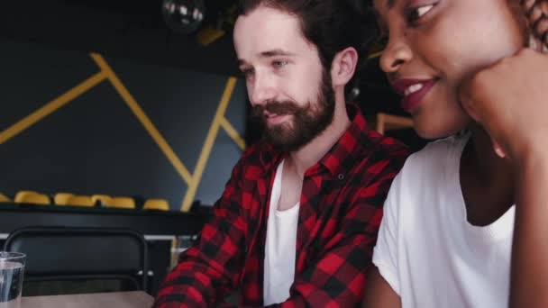 Bearded man and African American woman having meeting — Stock Video