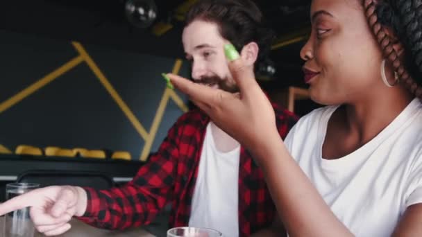 Bearded man and African American woman having meeting
