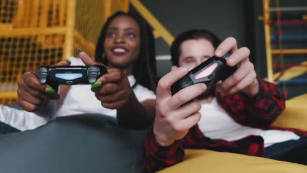 Portrait of African American woman and bearded man with joysticks — Stock Video