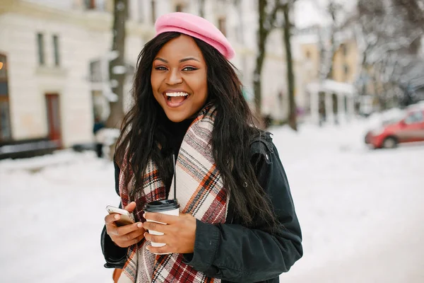 Elegant black girl in a winter city