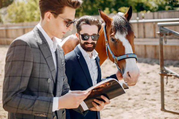 Handsme men standing in a ranch — Stock Photo, Image