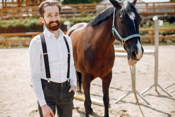 Handsme man standing in a ranch — Stock Photo, Image