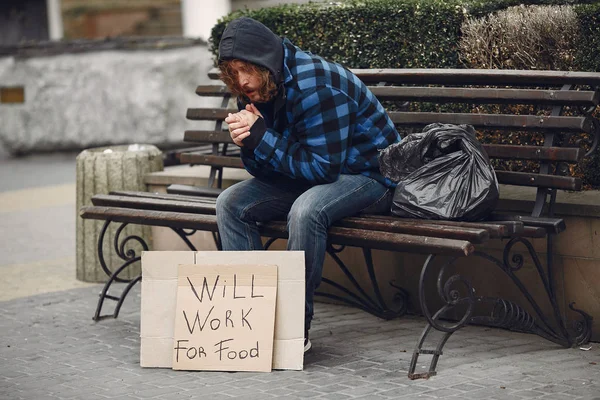 Homeless man in a durty clothes autumn city — Stock Photo, Image