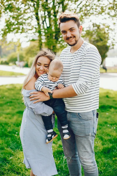 Beautiful family in a park — Stock Photo, Image