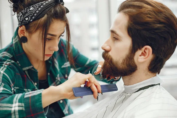 Stylish man sitting in a barbershop — Stock Photo, Image