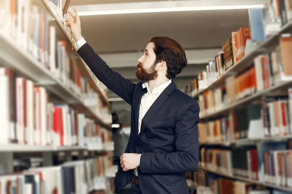 Handsome guy study at the library — Stock Photo, Image