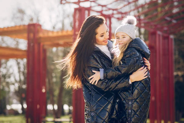 Cute and stylish family in a spring park — Stock Photo, Image