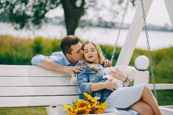 Family on a swing — Stock Photo, Image