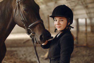 The rider in black form trains with the horse