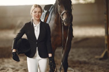 The rider in black form trains with the horse