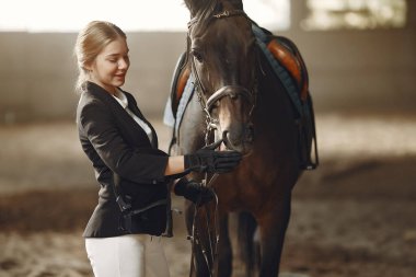 The rider in black form trains with the horse