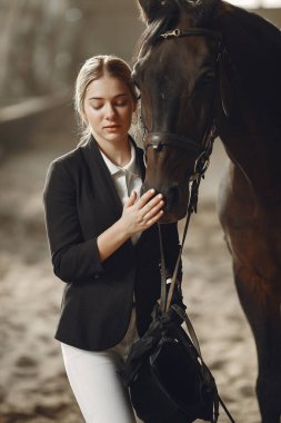 The rider in black form trains with the horse
