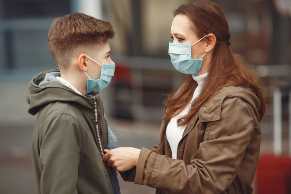 A boy and mother are wearing protective masks — ストック写真