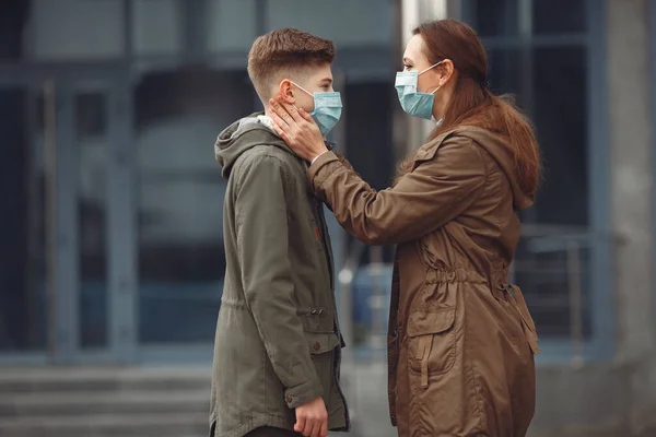 A boy and mother are wearing protective masks — 스톡 사진