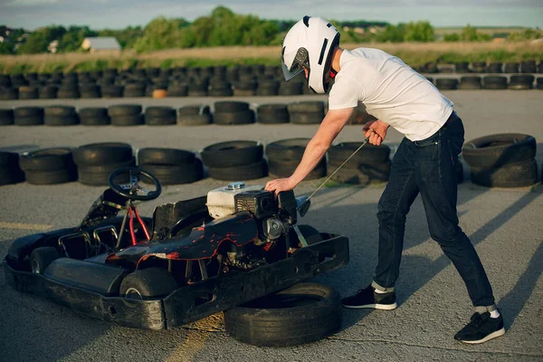 Handsome man in a karting with a car — Stok fotoğraf