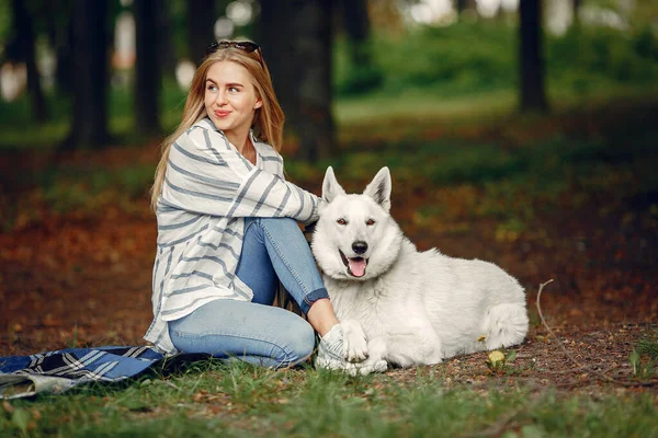 Elegant and stylish girl in a summer forest