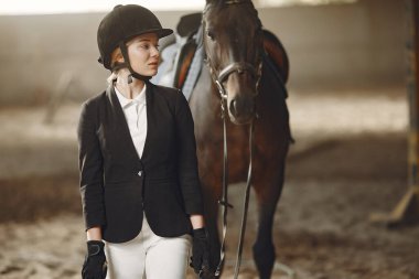 The rider in black form trains with the horse