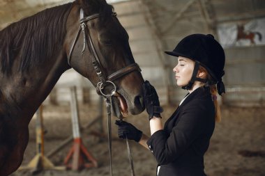 The rider in black form trains with the horse