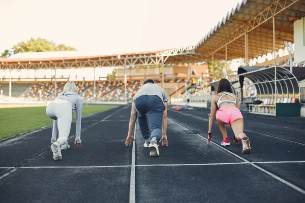 Sports people training at the stadium — 스톡 사진