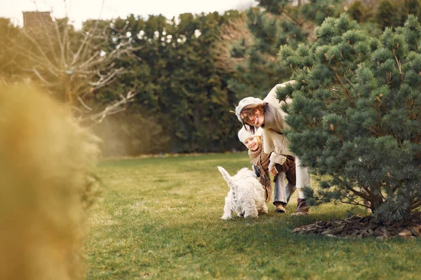 Mother with daughter walks with a dog — Stock Photo, Image