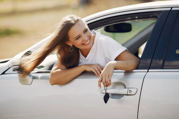 stock image Elegant woman looks out of the car window