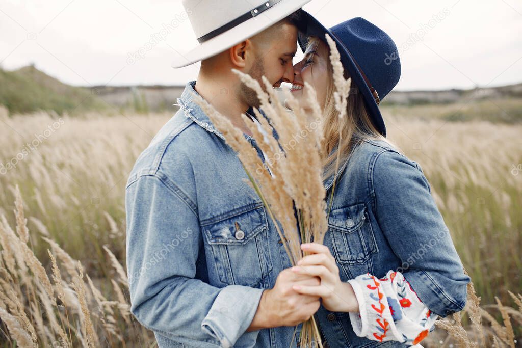 Very beautiful couple in a wheat field