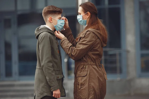 A boy and mother are wearing protective masks — 图库照片