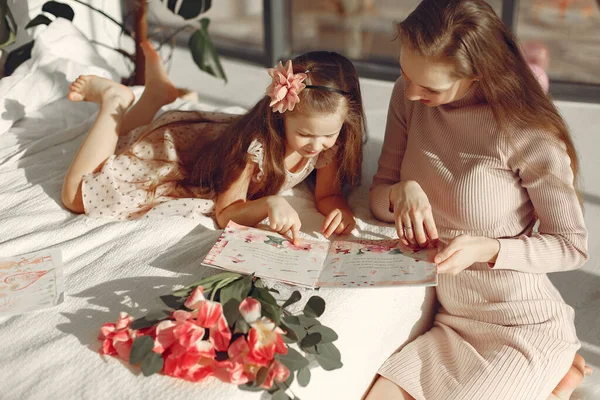 Children gave flowers to mom for mothers day